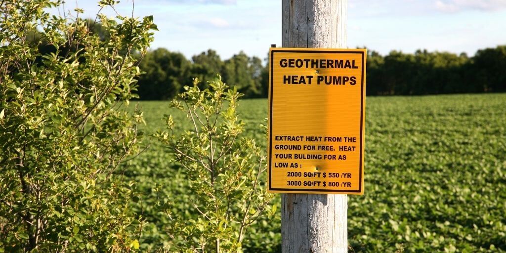 post with sign saying geothermal heat pumps.